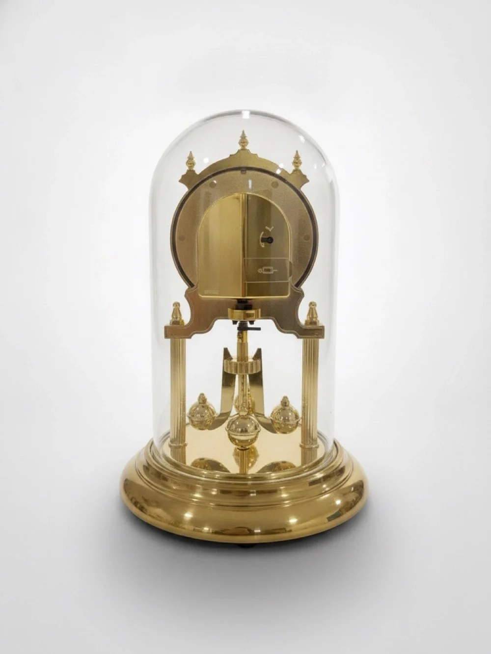 Vintage Howard Miller brass mantle clock with glass dome and pendulum Working